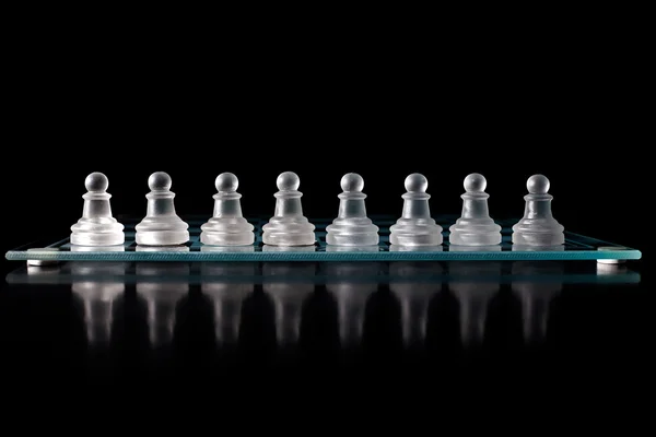 Glass chess board with chess pieces — Stock Photo, Image