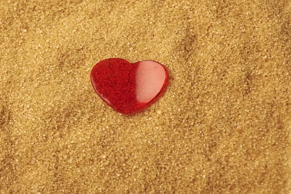 Valentines Day, red heart on brawn sugar — Stock Photo, Image