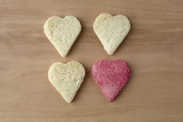 Red colored heart shape of bread — Stock Photo, Image