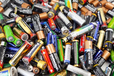 Different types of used batteries ready for recycling clipart