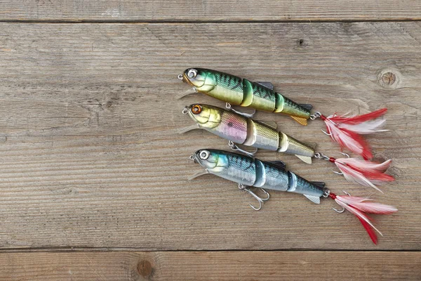 Colorful lures on the wooden pier — Stock Photo, Image