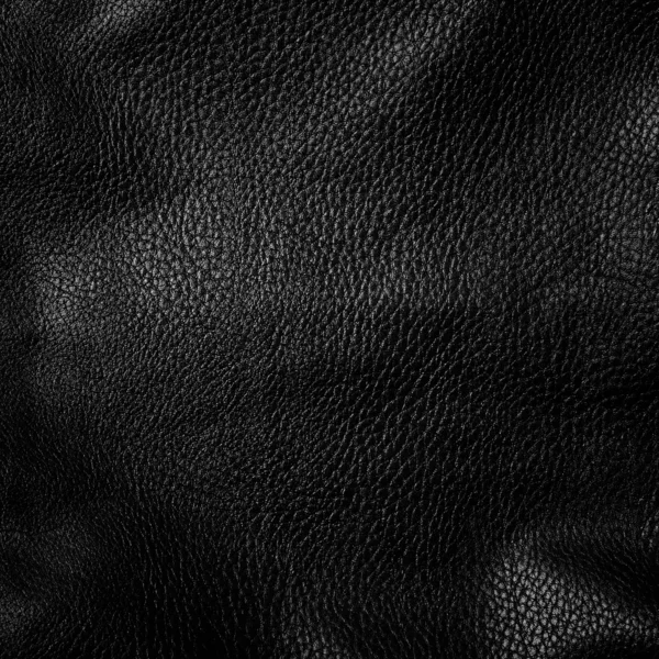 Schwarzer glänzender Lederhintergrund aus nächster Nähe — Stockfoto