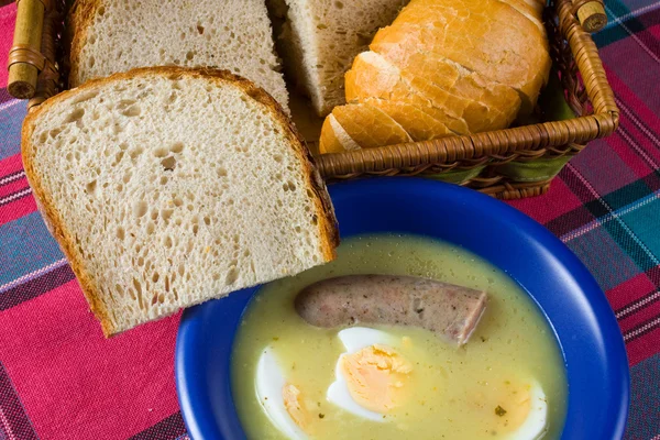 Traditional polish white borscht with eggs and sausage — Stock Photo, Image