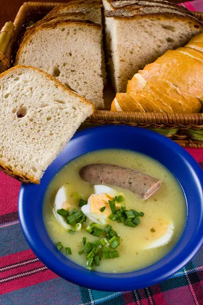 Traditional polish white borscht with eggs and sausage — Stock Photo, Image