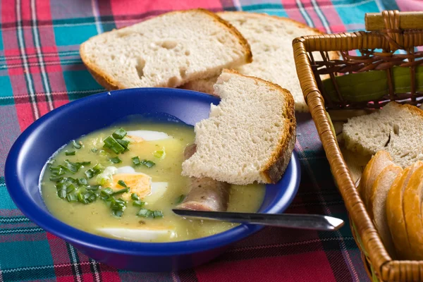 Traditional polish white borscht with eggs and sausage — Stock Photo, Image