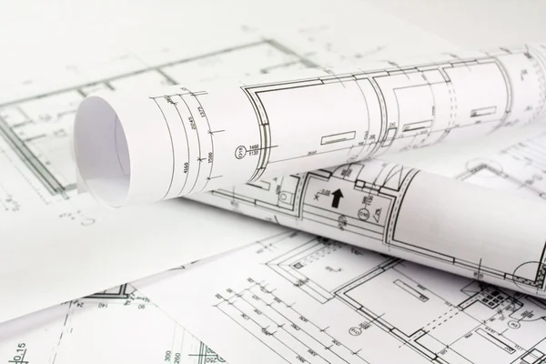 Architect rolls and house plans Stock Picture