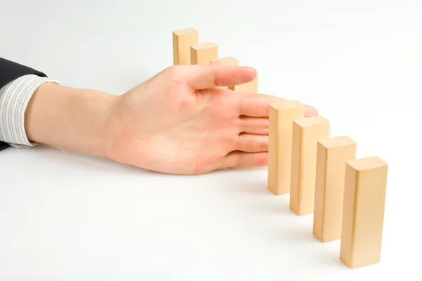 Concept for solution to a problem by stopping the domino effect — Stock Photo, Image