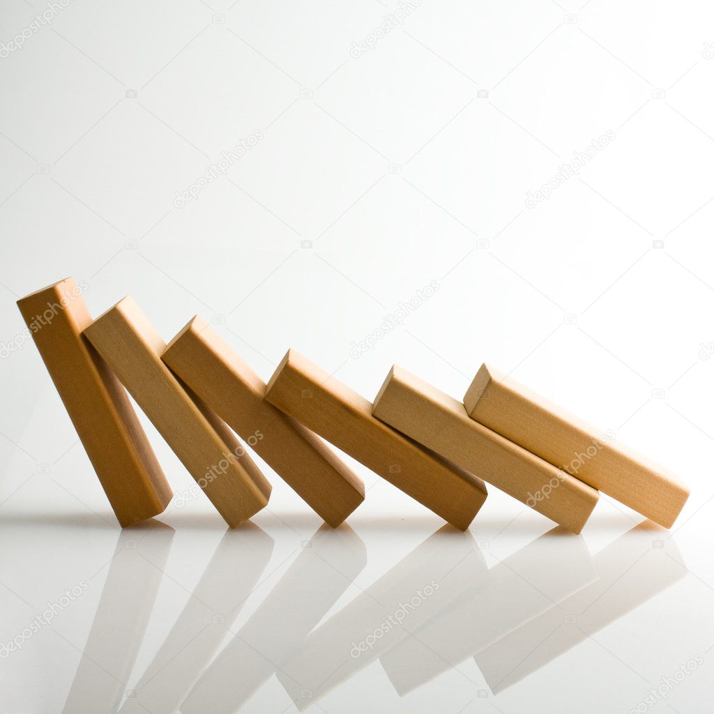 Domino effect - row of white dominoes on white background