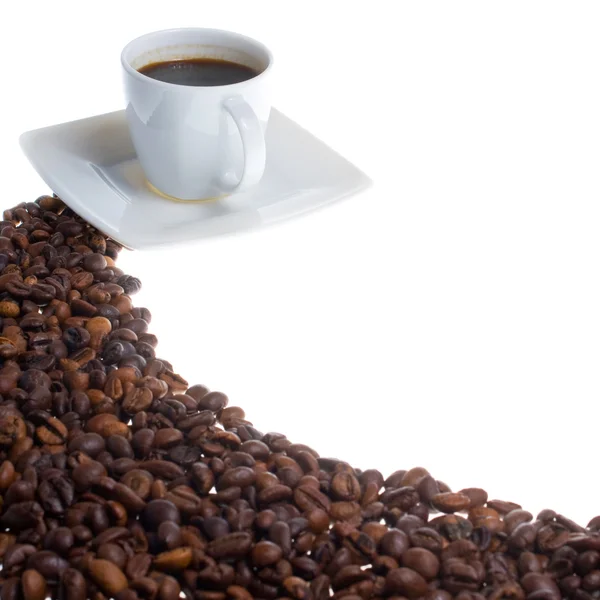 Kaffekopp och korn på vit bakgrund — Stockfoto