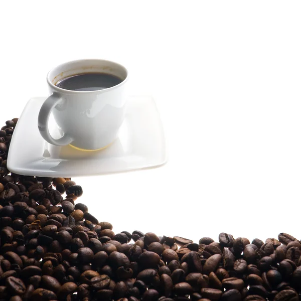 Coffee cup and grain on white background — Stock Photo, Image