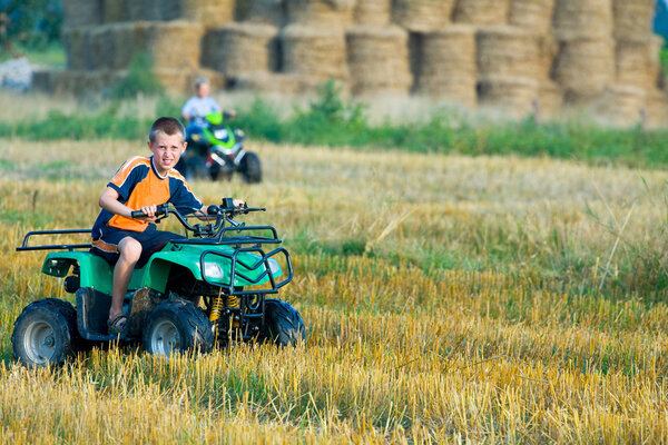 Boy riding a quad bike