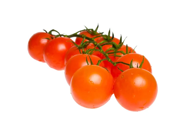 Saftige Bio-Kirschtomaten isoliert über weißem Hintergrund — Stockfoto