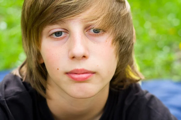 European school-age boy with blue eyes looking directly at the camera, close-up — Stock Photo, Image