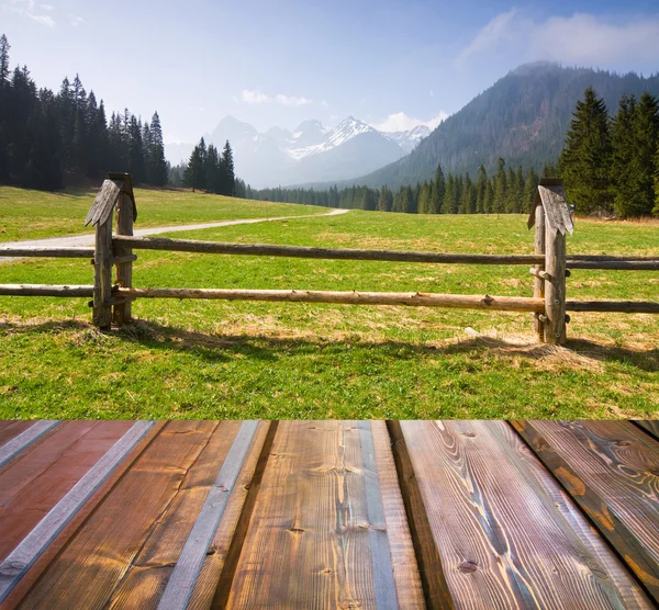 Mountains landscape with wooden planks — Stock Photo, Image