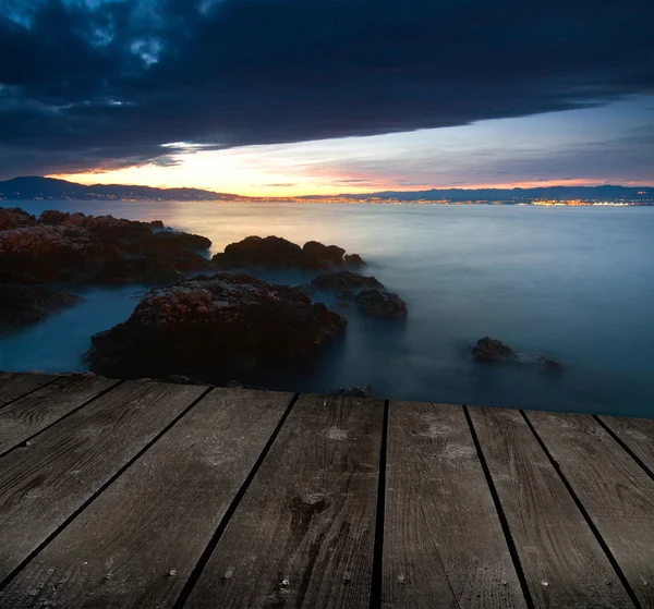 Sunset and empty wooden deck table. Ready for product montage display. — Stock Photo, Image