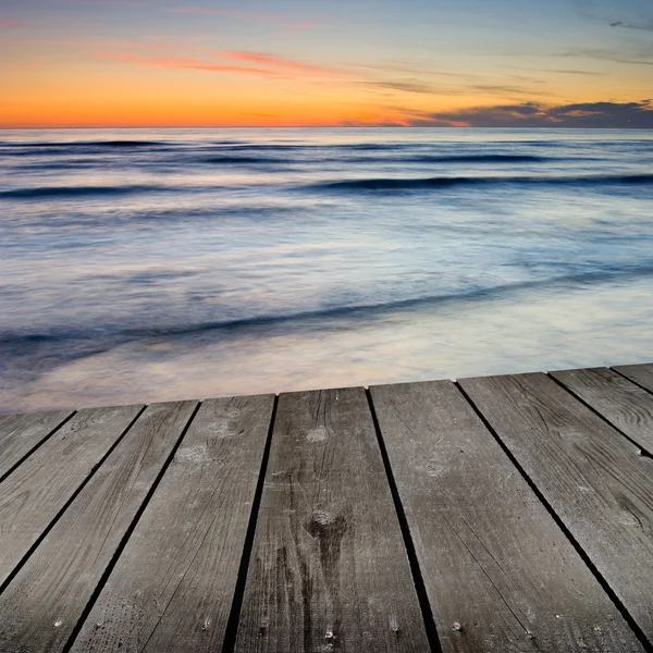 Sunset and empty wooden deck table. — Stock Photo, Image