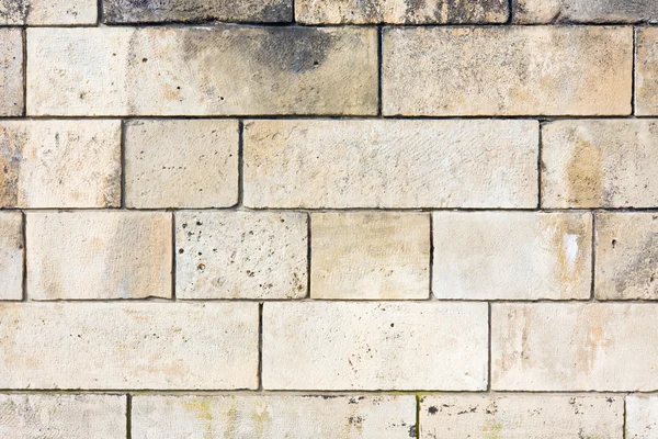 Textuur van een bruine stenen muur. — Stockfoto