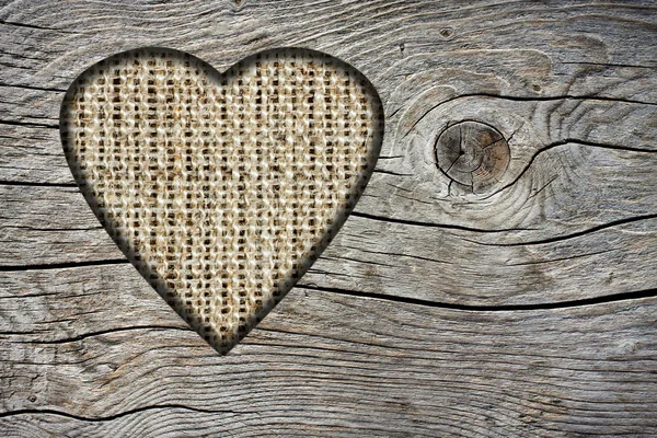 Background with a hole in the shape of heart and old wood board — Stock Photo, Image