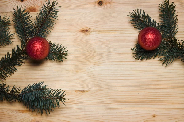 Christmas fir tree with decoration on a wooden board — Stock Photo, Image