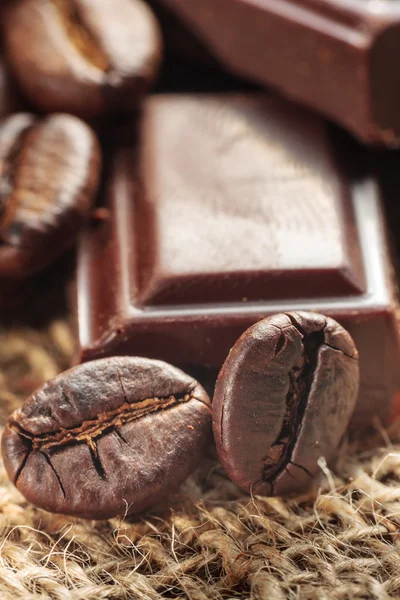 Close up of chocolate and coffee beans, shallow dof — Stock Photo, Image