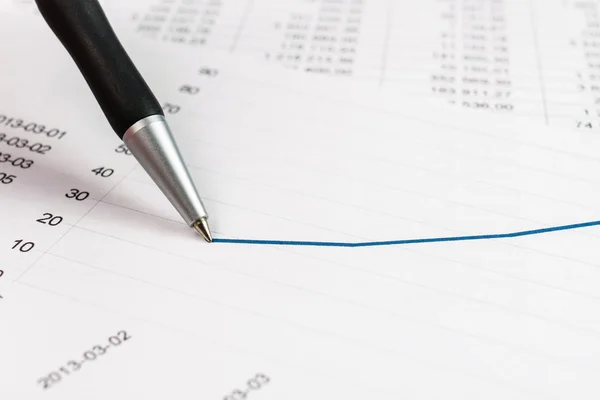 Businessman showing a diagram on a financial report using a pen — Stock Photo, Image