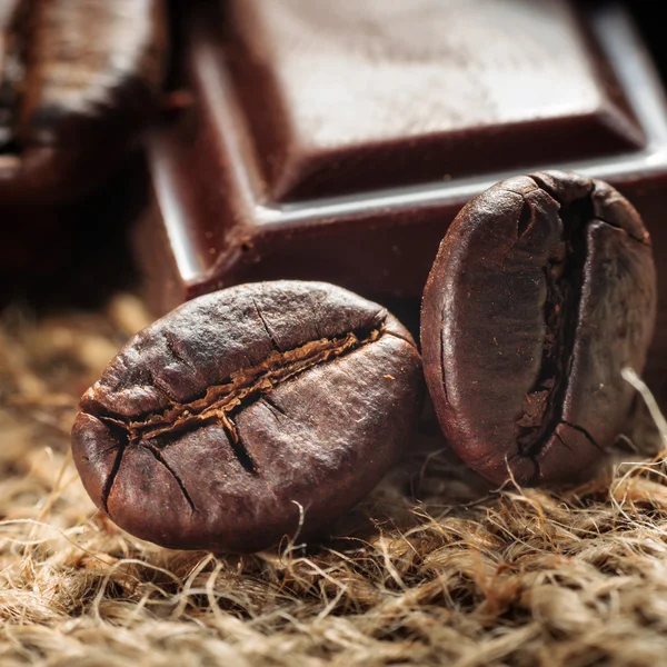 Close up of chocolate and coffee beans, shallow dof — Stock Photo, Image