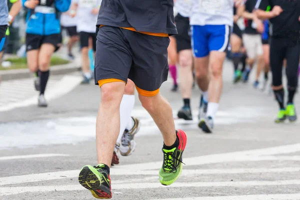 Detail of the legs of runners at the start of a marathon race — Stock Photo, Image