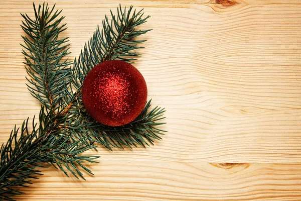 Christmas fir tree with decoration on a wooden board — Stock Photo, Image