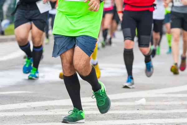 Detail of the legs of runners at the start of a marathon race — Stock Photo, Image