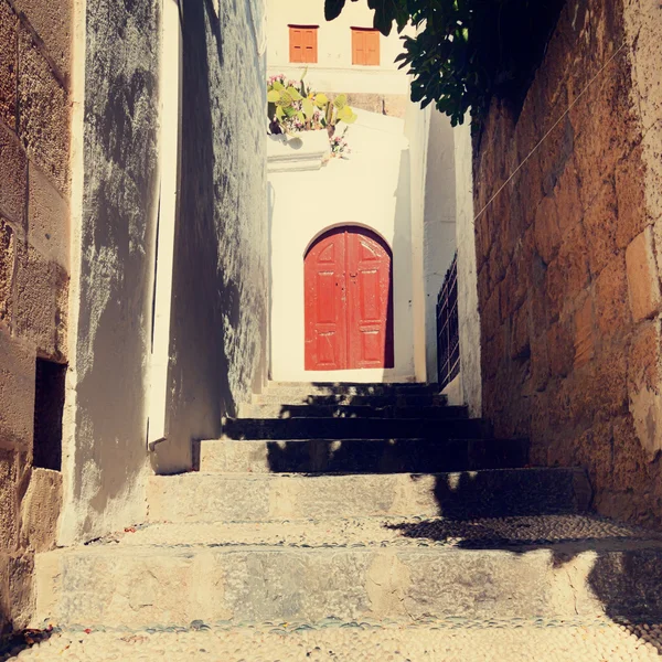Vintage photo of narrow street in Lindos. Rhodes, Greece — Stock Photo, Image
