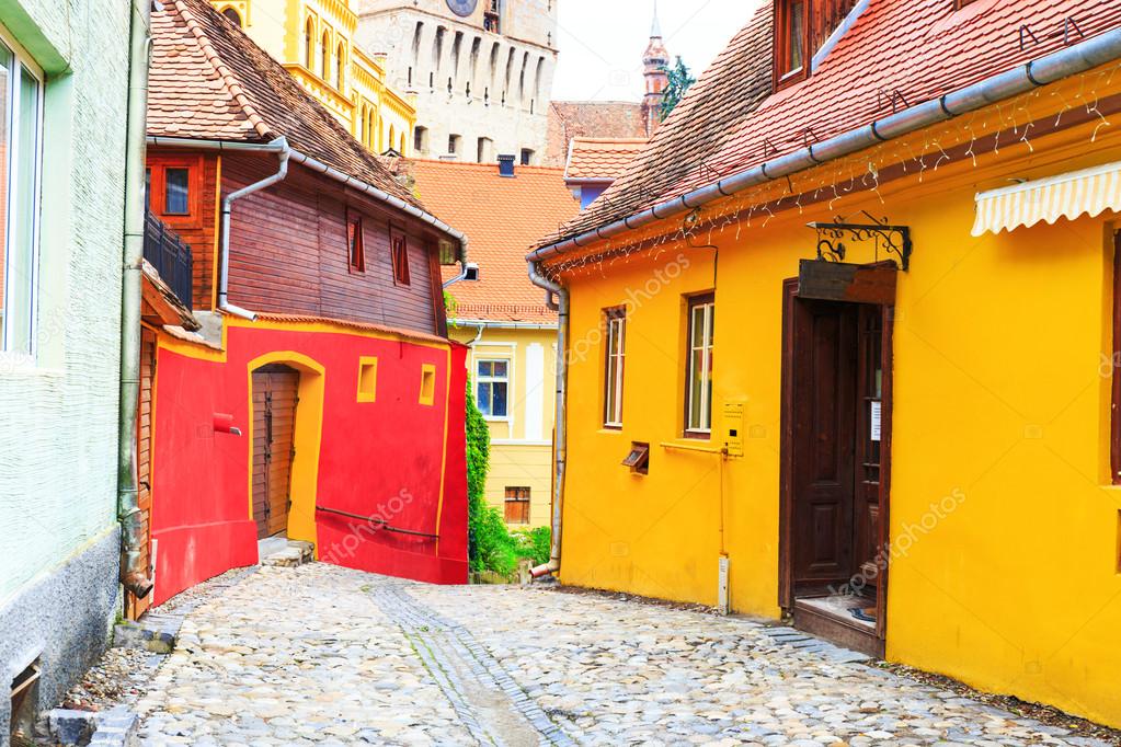 Medieval street view in Sighisoara founded by saxon colonists in XIII century, Romania