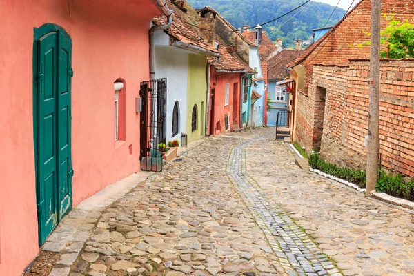 Medieval street view in Sighisoara founded by saxon colonists in — Stock Photo, Image