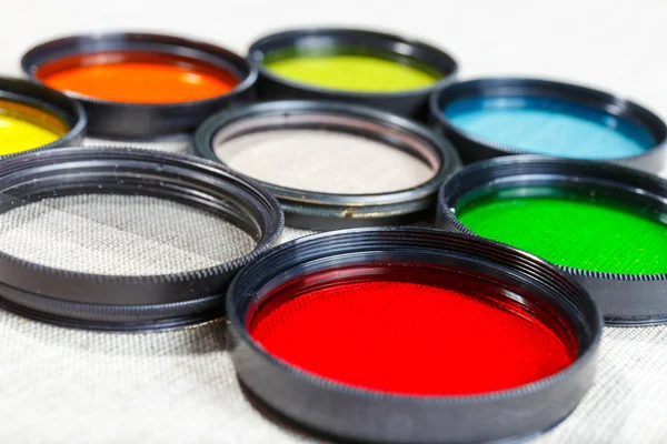 Color filters for lenses on bright background — Stock Photo, Image