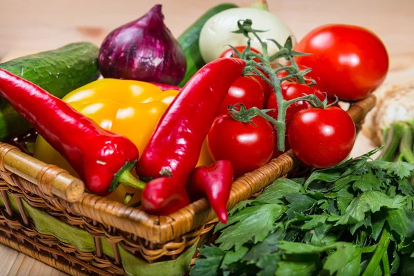 Close up of various colorful raw vegetables in a basket — Stock Photo, Image