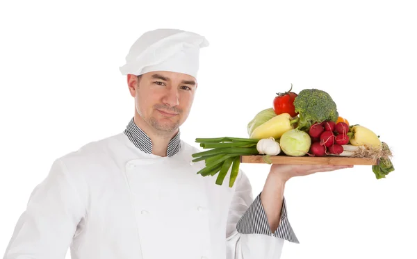 Jovem chef segurando vegetais frescos — Fotografia de Stock