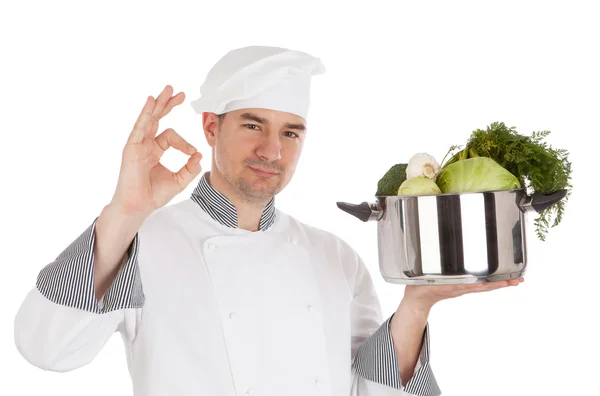 Chef com sinal OK e pote de retenção com legumes . — Fotografia de Stock