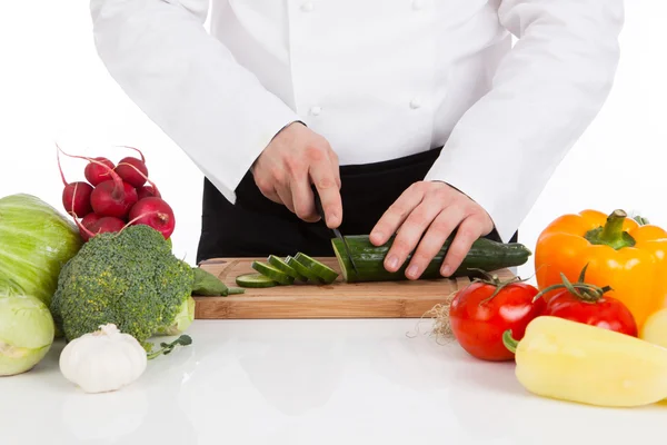 Chef hands cutting cucumber — Stock Photo, Image