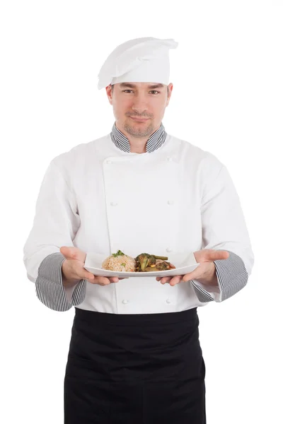 Chef showing and holding a plate of prepared food — Stock Photo, Image