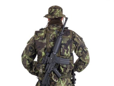 Soldier in camouflage and modern weapon M4. clipart