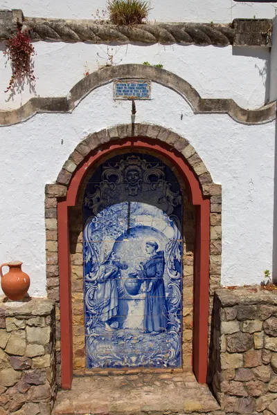 Small altar made ??of Azulejos in the Alte - famous village in the Algarve, Portugal — Stock Photo, Image