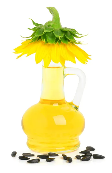 Caraffa con olio di girasole e un girasole su di esso — Foto Stock