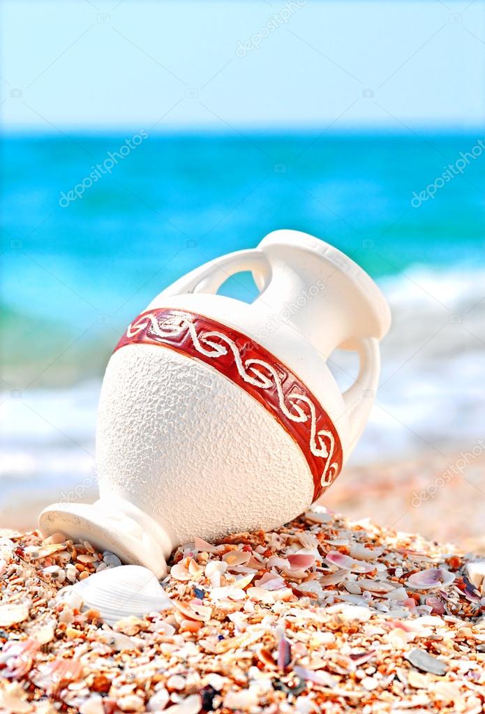 Beautiful vase on the seashore against blue sky