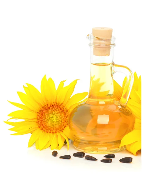 Carafe with vegetable oil and sunflowers — Stock Photo, Image