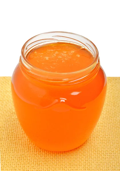 Glass jar with golden fresh honey — Stock Photo, Image