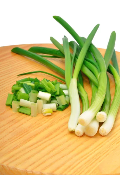 Green onion on the wooden board — Stock Photo, Image