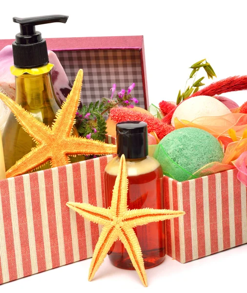 Gel bottles, bath bomnbs with starfishes in gift boxes — Stock Photo, Image