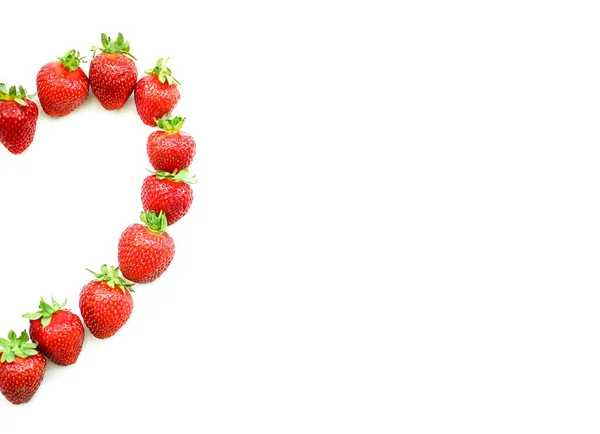 Strawberry in the shape of a heart isolated on a white background. Space for guests. — Stock Photo, Image