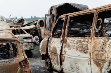 Mangled car bodies after destruction by Russian artillery in Ukraine, Bucha