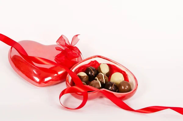 Chocolate candies in heart shaped box — Stock Photo, Image