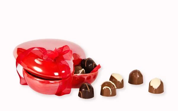 Chocolate candies in heart shaped box — Stock Photo, Image